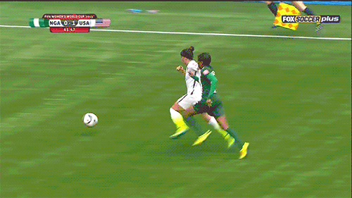 Ali Krieger sends in a cross to Alex Morgan.