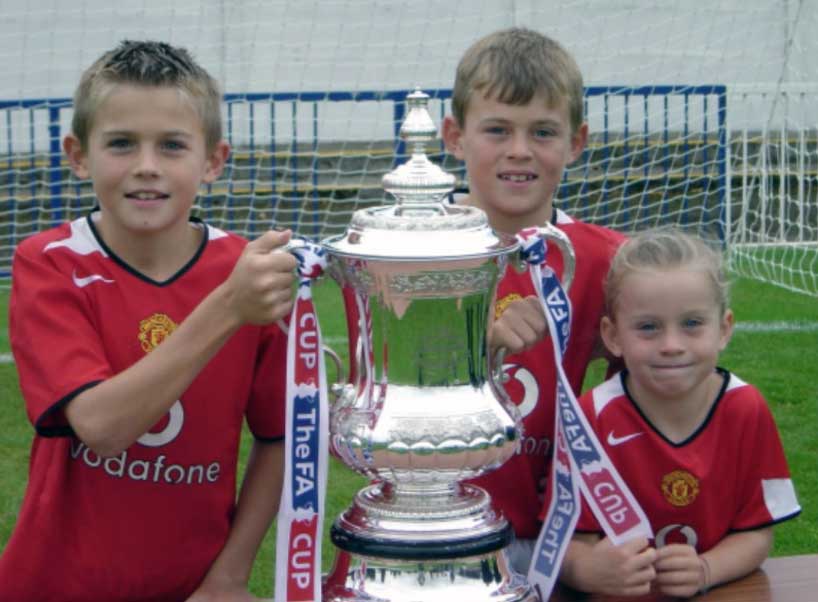 Alessia Russo with brothers as kids in Manchester United kits