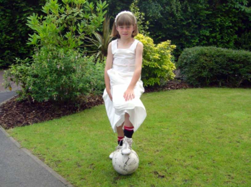 Alessia Russo as a young child in dress and cleats. (Russo family)