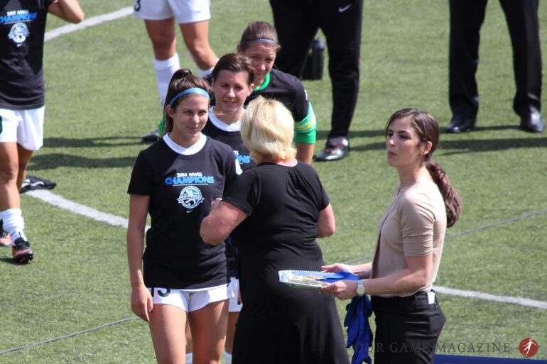 FC Kansas City's Erika Tymrak, Amy LePeilbet, and Nicole Barnhart accepting their medals from NWSL Executive Director Cheryl Bailey after the 2014 NWSL Championship game at Starfire Stadium on August 31, 2014.