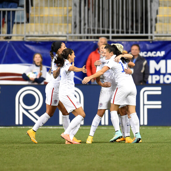 USWNT celebrates its 3-0 win over Mexico to qualify for the 2015 World Cup.