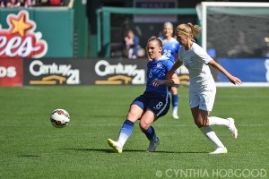 USA's Amy Rodriguez and New Zealand's Katie Bowen during a friendly at Busch Stadium on April 4, 2015.