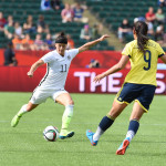 Ali Krieger clears the ball before Oriánica Velásquez gets to it.