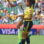 Abby Wambach and Oriánica Velásquez compete for a header.