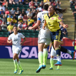 USA's Abby Wambach and Colombia's Oriánica Velásquez battle for a header.