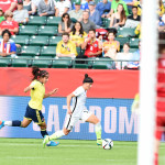 The USA's Ali Krieger shields the ball.