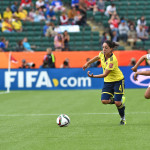 Colombia's Diana Ospina and the USA's Carli Lloyd go after the ball.