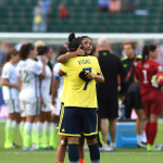 Colombia's Ingrid Vidal is consoled after the match.