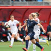 Eugénie Le Sommer getting past England's defense.