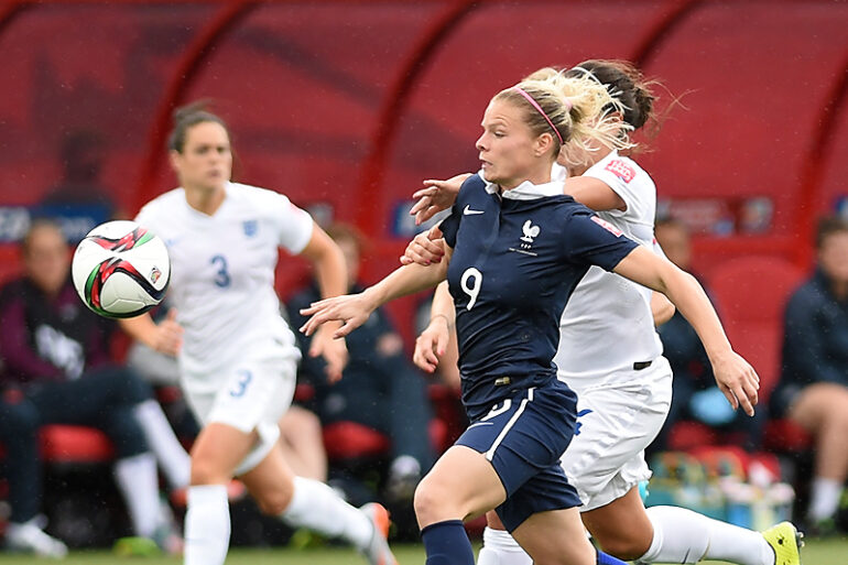 Eugénie Le Sommer getting past England's defense.