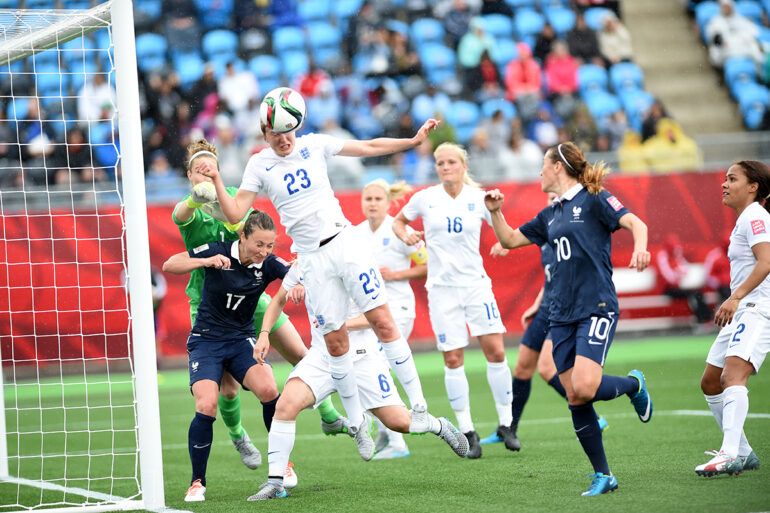 Ellen White (23) heads the ball away during the first half against France in Moncton, New Brunswick.