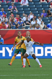Nigeria's Francisca Ordega holds off the Australian defense.
