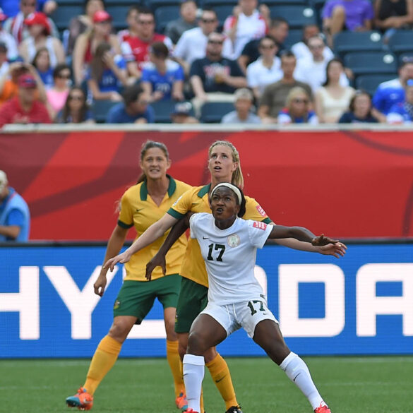 Nigeria's Francisca Ordega holds off the Australian defense.