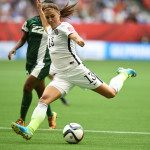 USA's Alex Morgan gets a shot off against Nigeria.