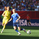 USA's Becky Sauerbrunn clears the ball.