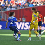 USA's Lauren Holiday and Sweden's Lotta Schelin.