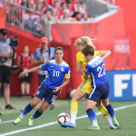 Sweden's Sofia Jakobsson is surrounded by USA's Carli Lloyd and Meghan Klingenberg.