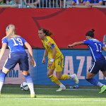 Sweden's Lotta Schelin against USA's Julie Johnston and Ali Krieger.