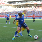 USA's Meghan Klingenberg shields the ball from Sweden's Sofia Jakobsson.