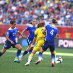 Sweden's Lotta Schelin is surrounded by USA's Carli Lloyd, Lauren Holdiay, and Becky Sauerbrunn.