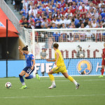 USA's Ali Krieger gets to the ball before Sweden's Lina Nilsson.