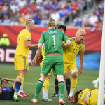 The aftermath of a collision between USA's Carli Lloyd and Sweden's Jessica Samuelsson.