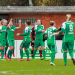 Werder Bremen players celebrate Wallenhorst's goal.