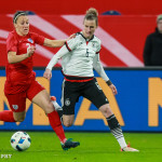 Lucy Bronze (ENG) and Simone Laudehr (GER) battle for the ball.