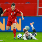 Lucy Bronze (ENG) and Simone Laudehr (GER) vie for the ball.