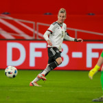 Simone Laudehr (GER) crosses the ball.