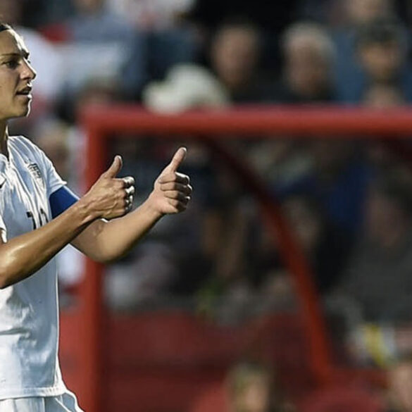 Carli Lloyd giving a thumbs-up.