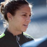 Carli Lloyd addressing the media during pregame practice.