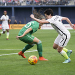 Meghan Klingenberg with the step-over and move to the endline.