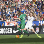 Ireland's Ruesha Littlejohn is challenged by the USA's Sam Mewis.