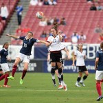 Elise Bussaglia (15) and Sara Däbritz (23) vie for the ball.