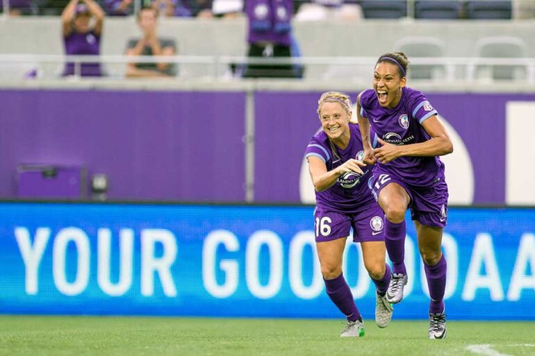 Kristen Edmonds celebrating with the Orlando Pride by Mark Thor