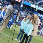 Christie Rampone with her daughters at a pregame ceremony honoring Rampone for her USWNT career.