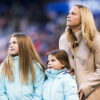 Christie Rampone and her daughters at a pregame ceremony honoring Rampone for her USWNT career.