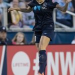 Abby Dahlkemper heads the ball (Shane Lardinois).