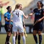 Captains' handshake. Becky Sauerbrunn (4) and Abby Erceg. (Shane Lardinois)