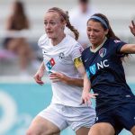 Becky Sauerbrunn and Ashley Hatch battling for position. (Shane Lardinois)