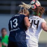 Abby Dahlkemper and Maegan Kelly vie for the ball. (Shane Lardinois)