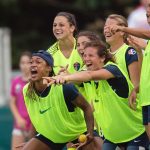 The Courage celebrating Kristen Hamilton's goal on the sideline. (Shane Lardinois)