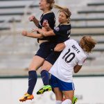 Captain Comma gets up for the ball. Sam Mewis heads the ball over teammate McCall Zerboni and Boston Breaker Rosie White. (Shane Lardinois)