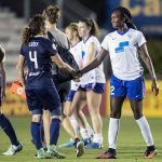 Postgame handshake between Elizabeth Eddy and Ifeoma Onumonu. (Shane Lardinois)