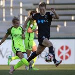 A study in vertical contrasts between Jess Fishlock and Sam Mewis. (Shane Lardinois)