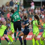 Seattle's Haley Kopmeyer punches the ball. (Shane Lardinois)