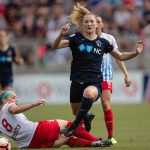 Sam Mewis maneuvers past Julie Ertz. (Shane Lardinois)