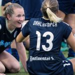 Bruins sharing a moment after the game. Sam Mewis and Abby Dahlkemper. (Shane Lardinois)