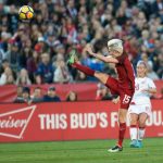 Megan Rapinoe gets a leg up. (Manette Gonzales)